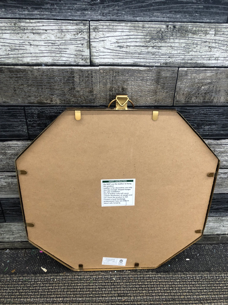 OCTAGONAL GOLD MIRROR W/LEATHER STRAP WALL HANGING.
