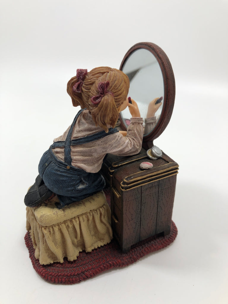 RESIN GIRL FIGURINE APPLYING MAKEUP.