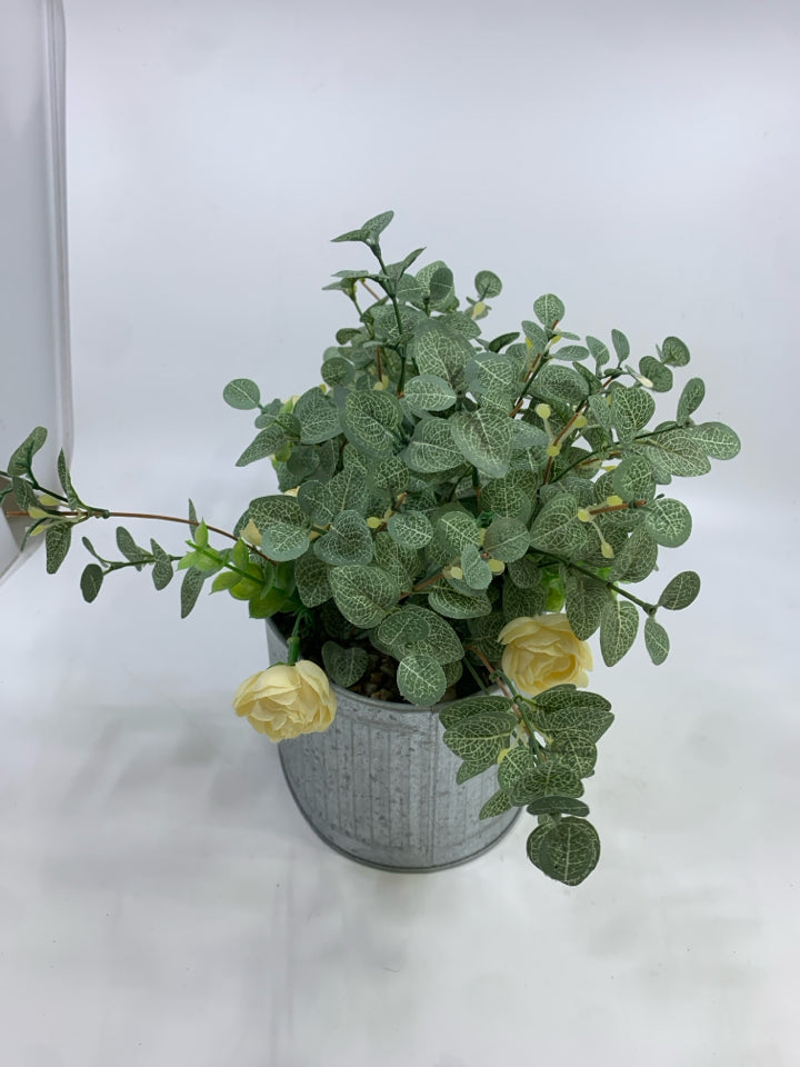 FAUX LEAVES & CREAM FLOWERS IN GALVANIZED TIN.