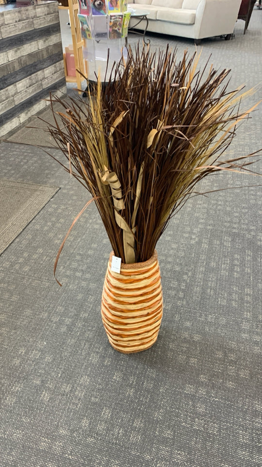 FAUX GRASS IN LARGE WOVEN BASKET VASE.