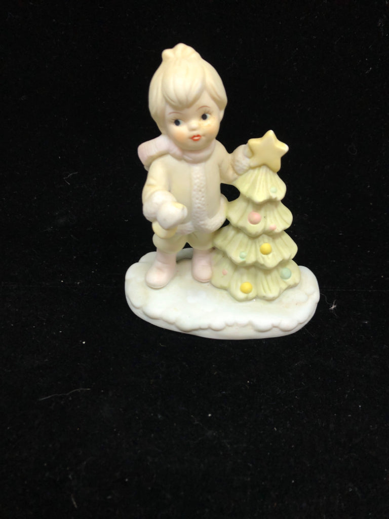 CHILD DECORATING TREE FIGURINE.