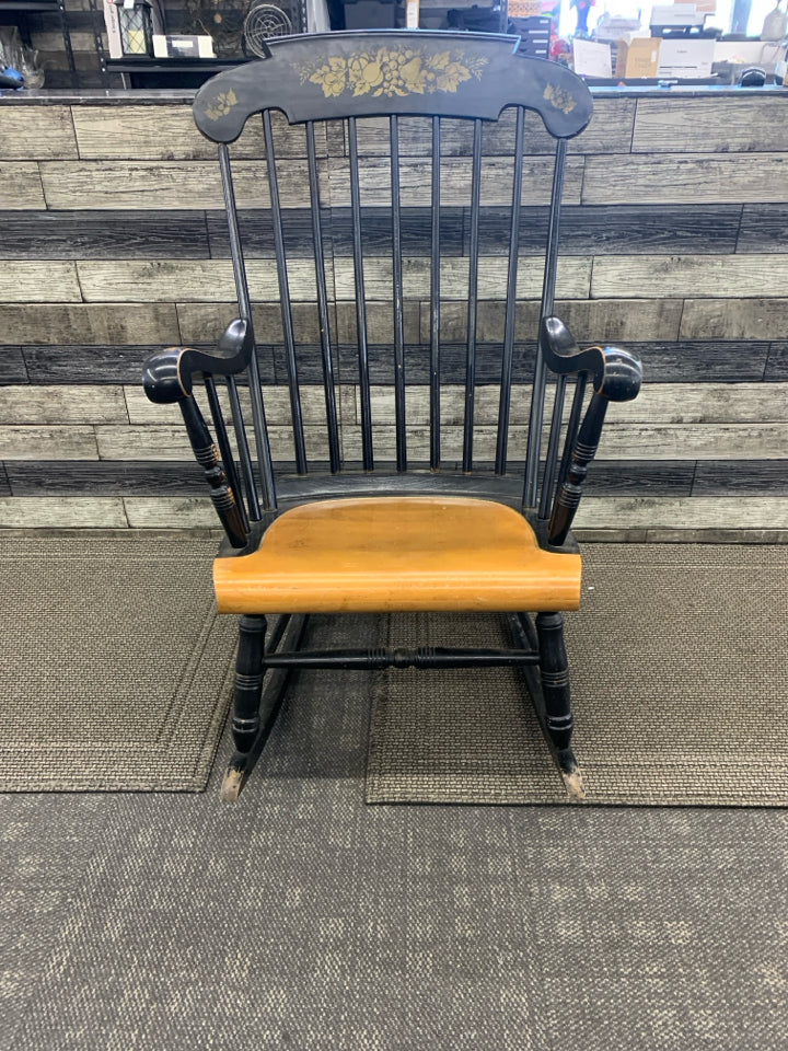 BLACK WOOD ROCKING CHAIR W FRUIT DETAILING.