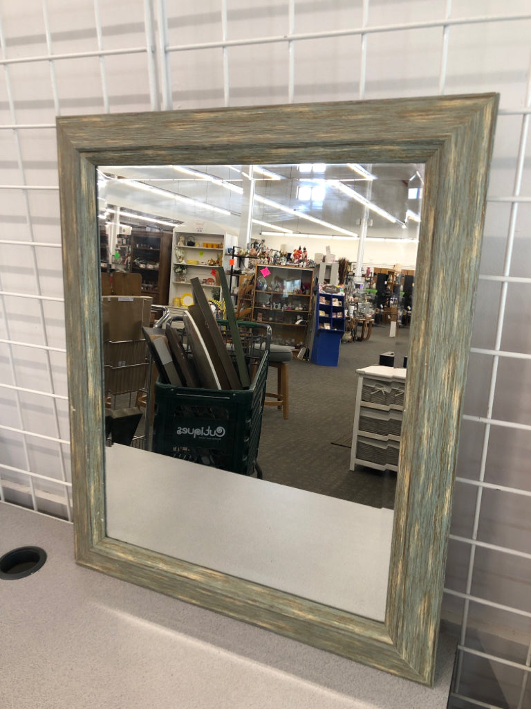 DISTRESSED BLUE WALL MIRROR.