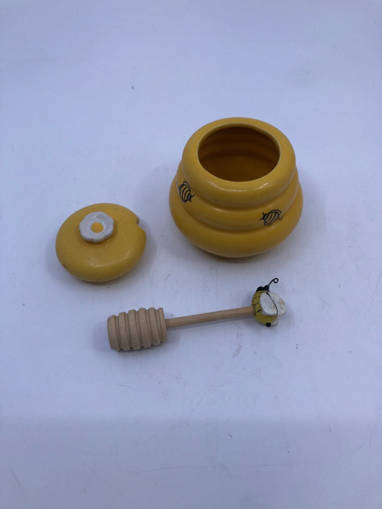 YELLOW HONEY JAR WITH SPOON AND LID.