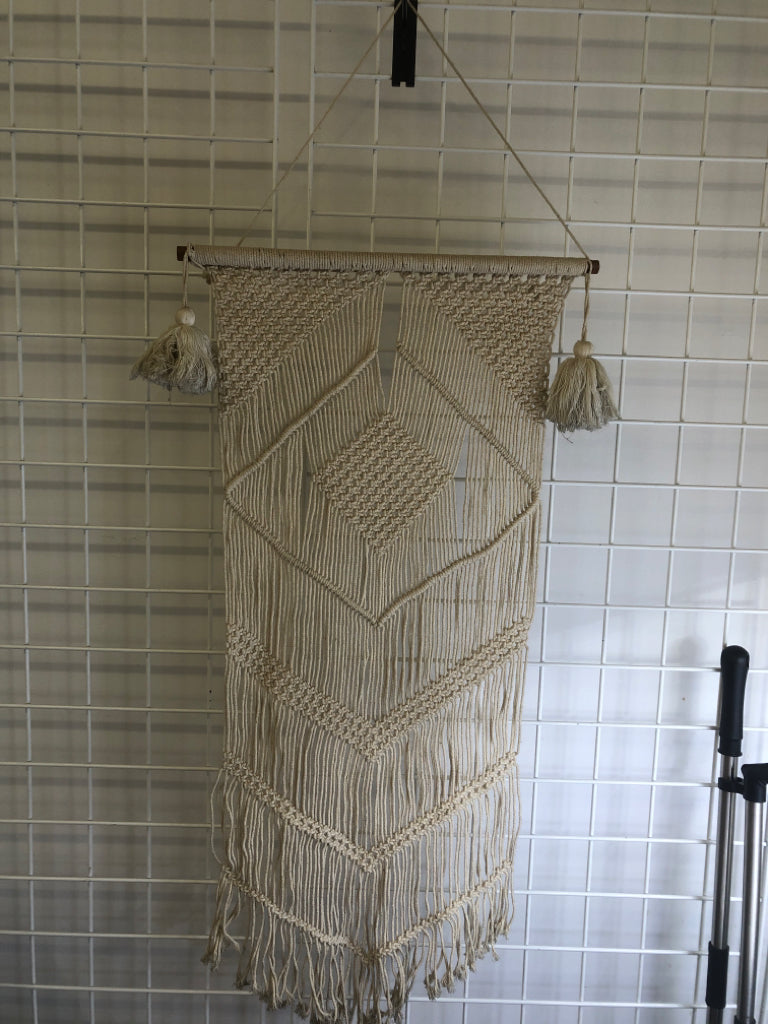 MACRAME WALL HANGING ON DOWEL W/ LARGE TASSELS.