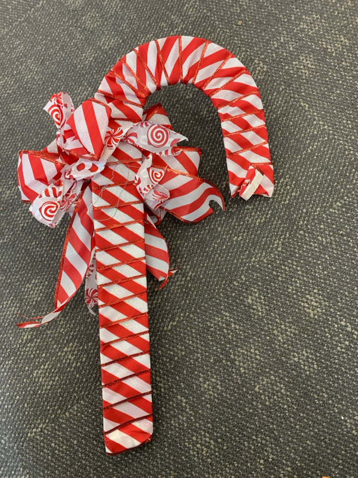 RED RIBBON CANDY CANE WALL HANGING.