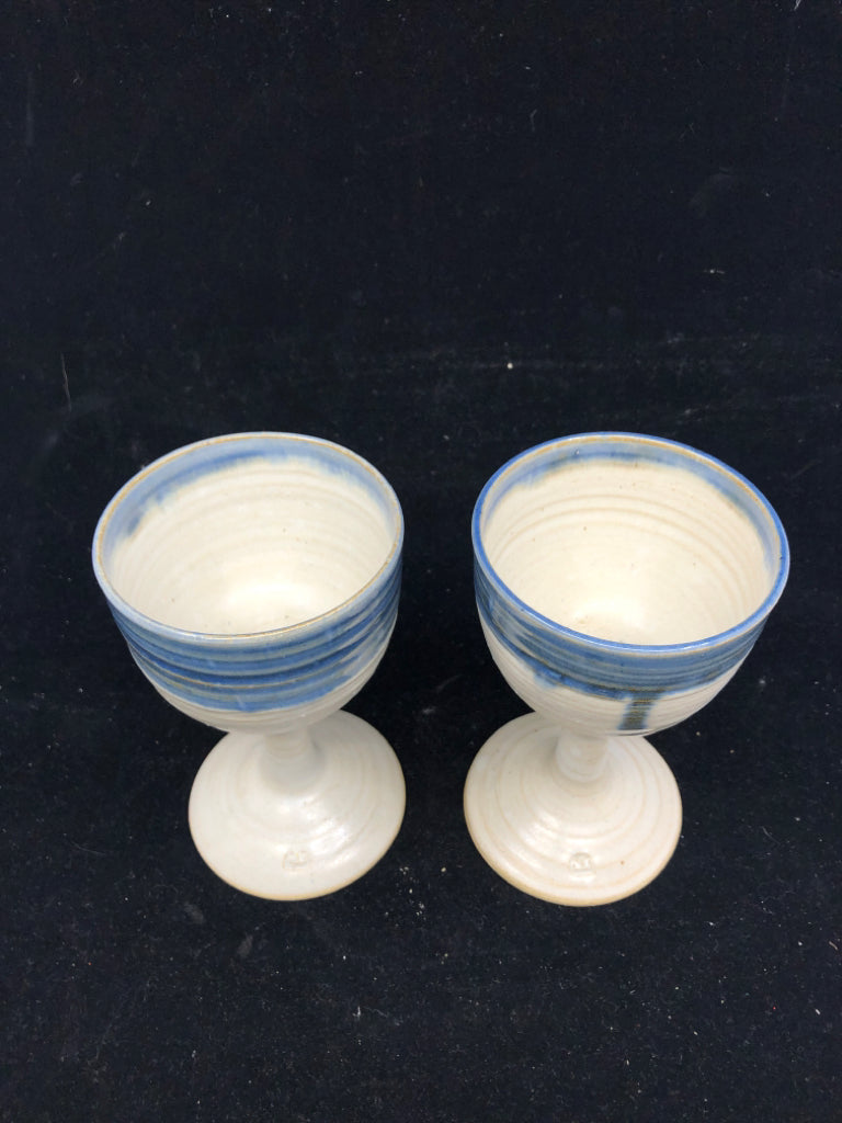 2 POTTERY WINE GLASSES WHITE/BLUE.