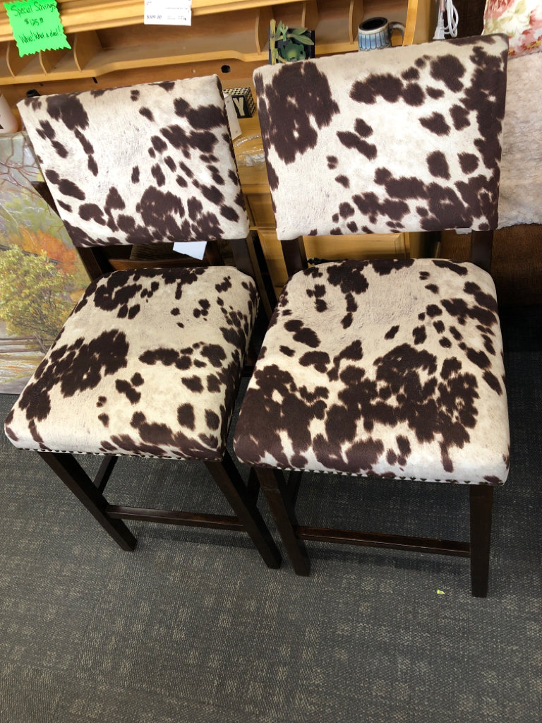 2-FAUX COW HIDE DARK WOOD STOOLS.