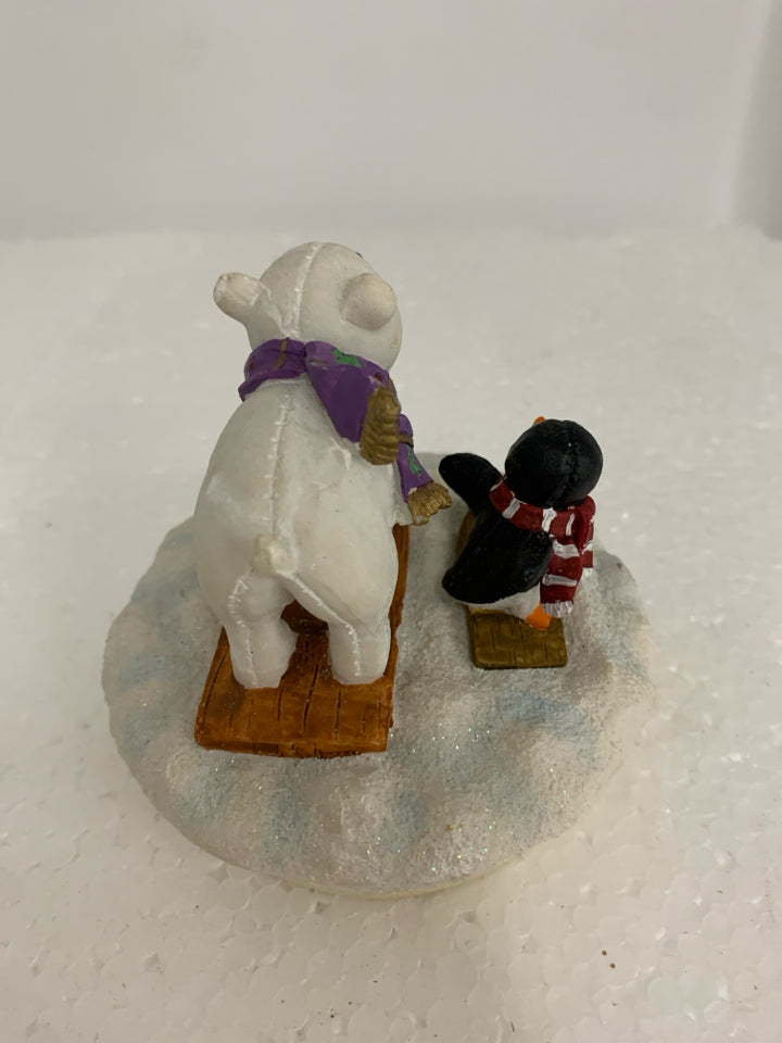 POLAR BEAR/PENGUIN ON SLEDS CANDLE TOPPER.