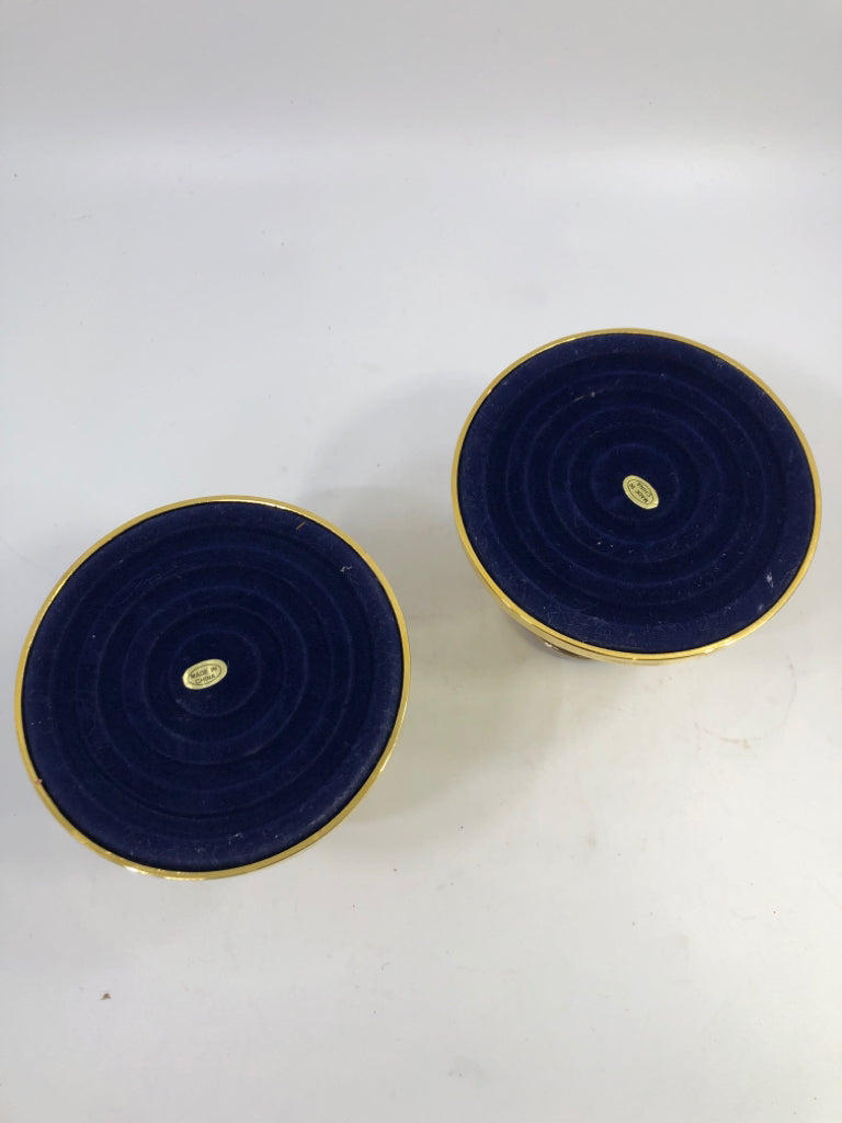 2PC GOLD & SILVER CANDLE HOLDERS.