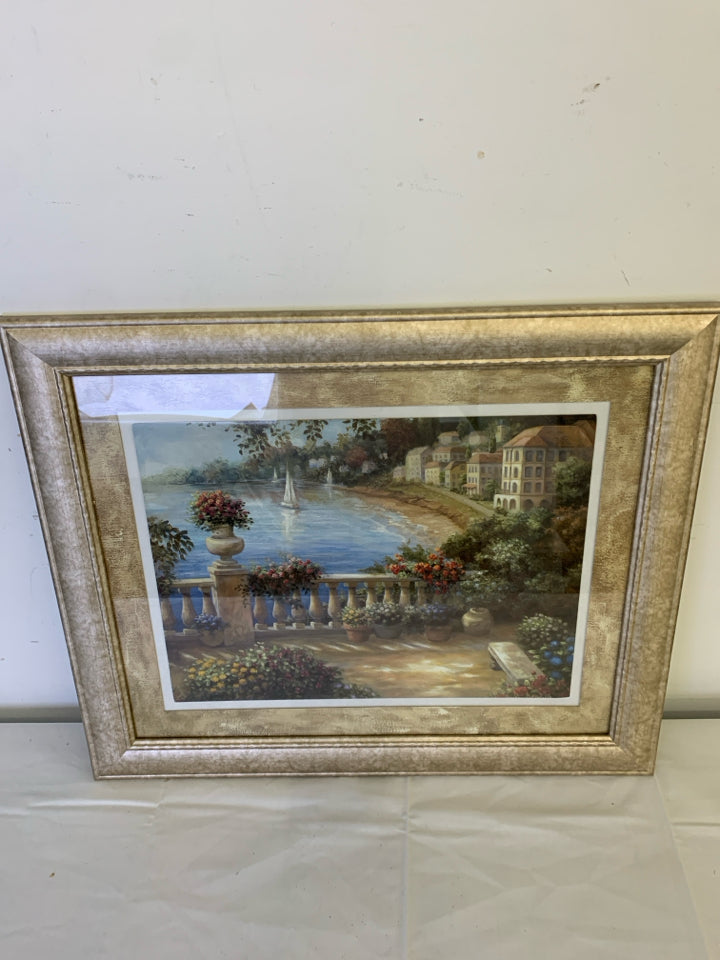 PORCH OVERLOOKING LAKE W SAILBOAT IN LIGHT GOLD FRAME.