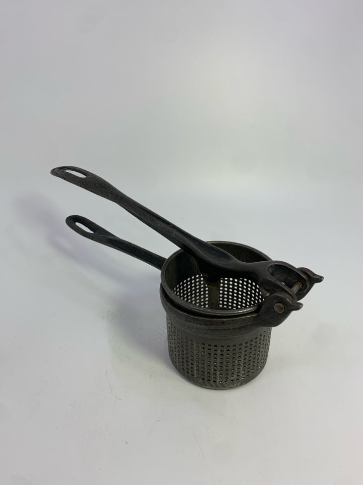 VTG CAST IRON POTATO RICER.