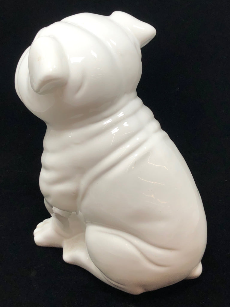 WHITE CERAMIC DOG FIGURINE.