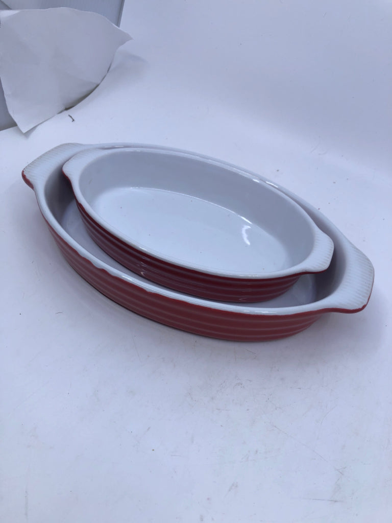 2 RED OVAL NESTING BAKING DISHES.