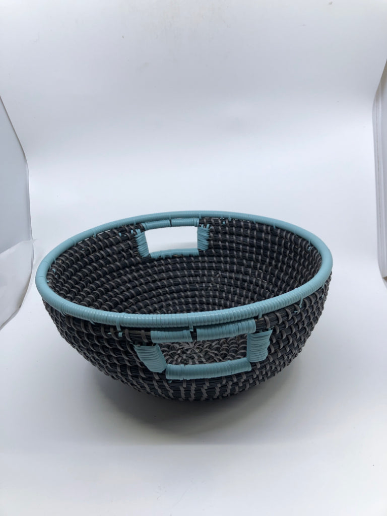 BLACK WOVEN BASKET W/ TEAL RIM/HANDLES.