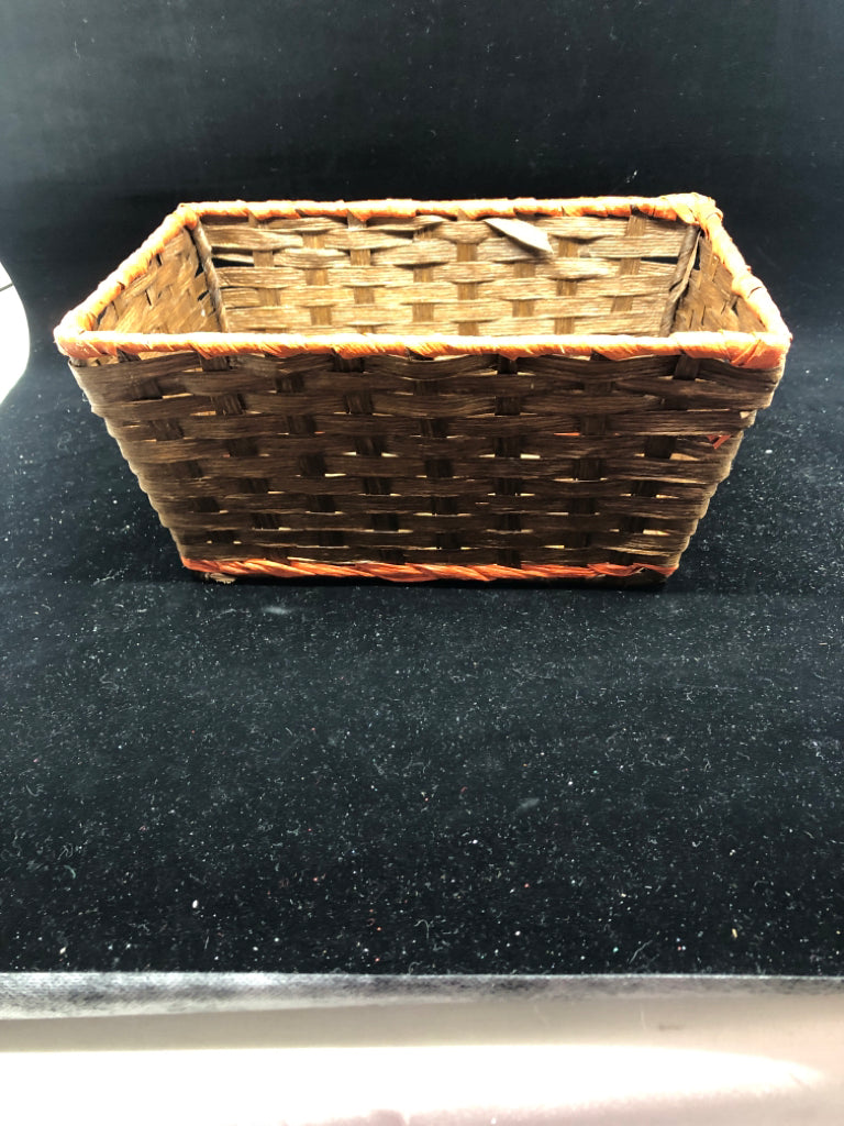 BROWN WOVEN BASKET W RED RIM.