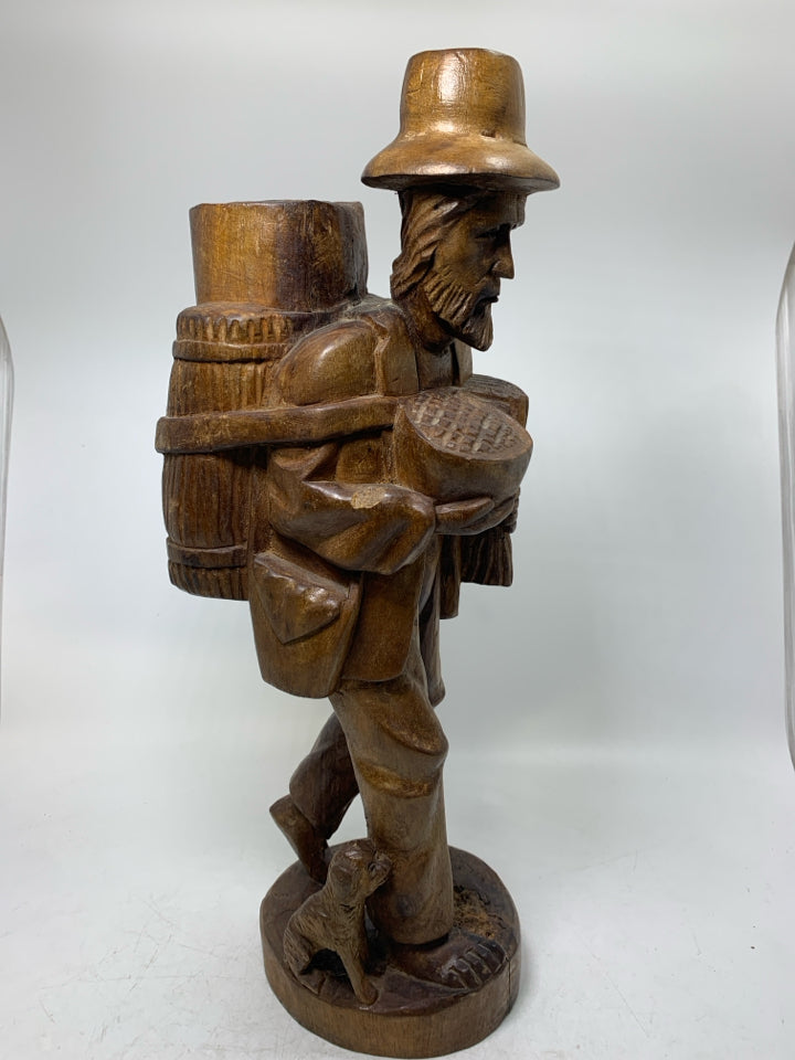 LARGE WOOD CARVED MAN W/ LARGE BACKPACK BAREFOOT WALKING.