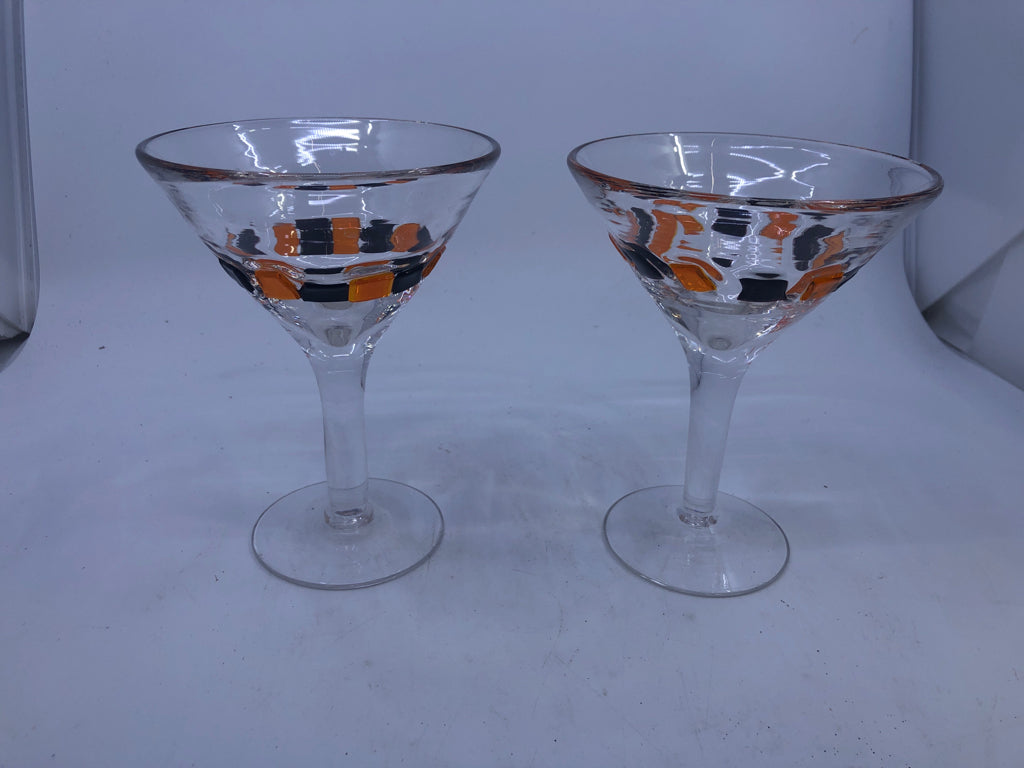 2 BLACK AND ORANGE MARTINI GLASSES.