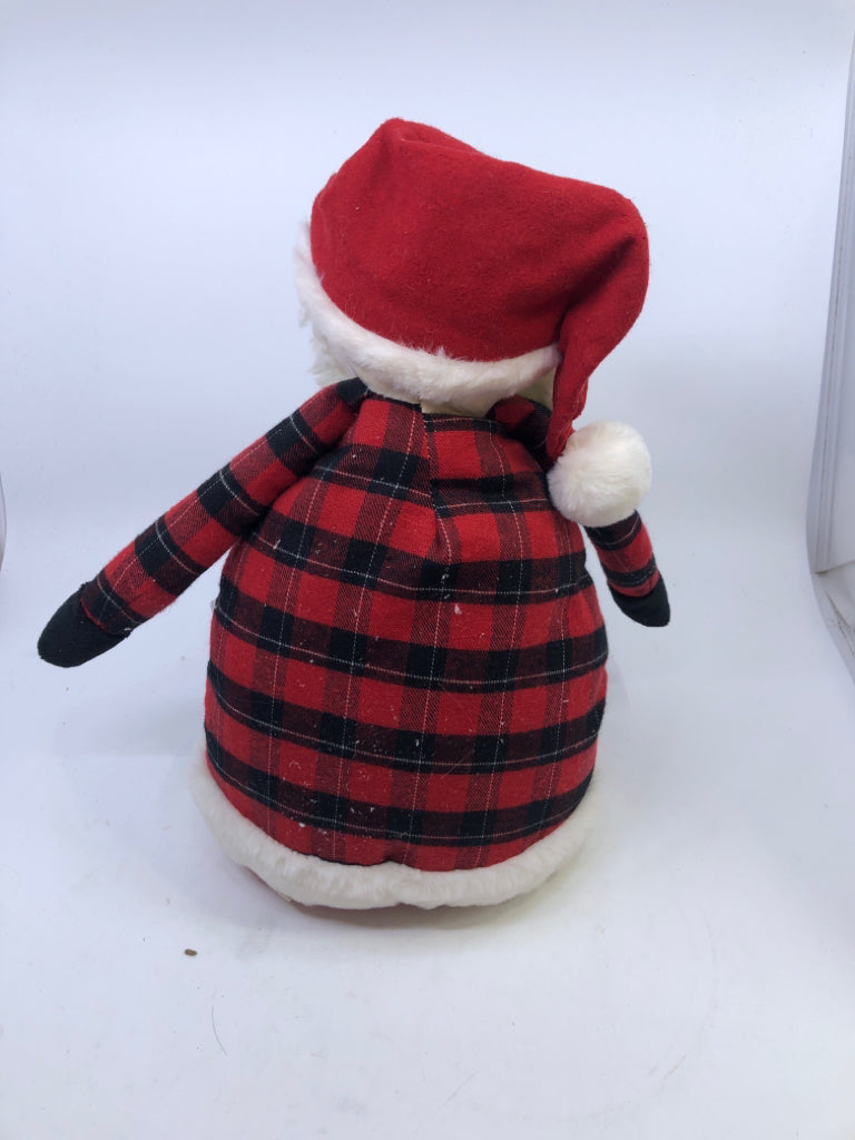 SITTING SHELF SANTA IN RED BUFFALO PLAID.