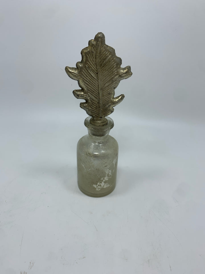 ART DECO GLASS BOTTLE W/LEAF TOPPER.