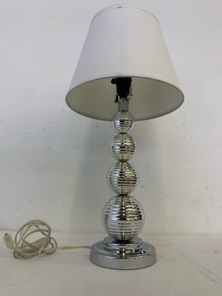 SILVER PLASTIC BASE LAMP W/WHITE SHADE.