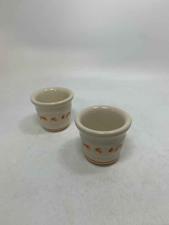 2 CANDY CORN VOTIVES POTTERY HOLDERS.
