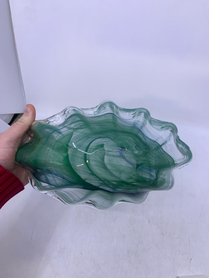 ABSTRACT OVAL GLASS W/ GREEN SWIRLS.