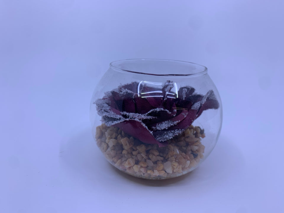 PURPLE FLORAL AND STONES IN GLASS JAR.