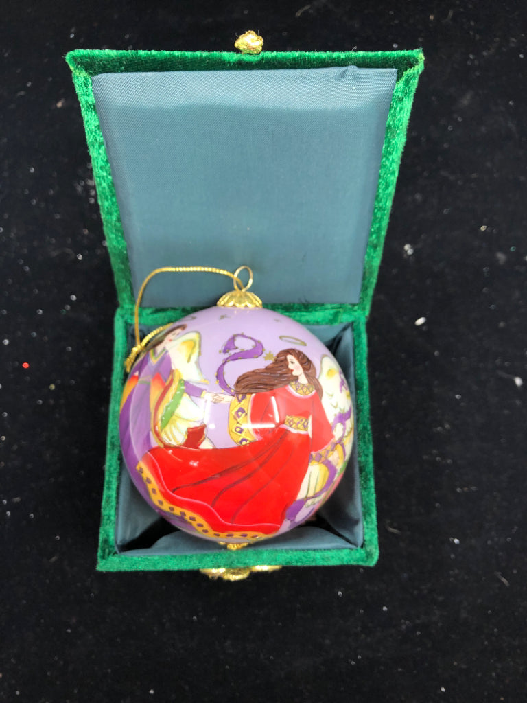 PURPLE ANGLE SPHERE ORNAMENT IN GREEN BOX.