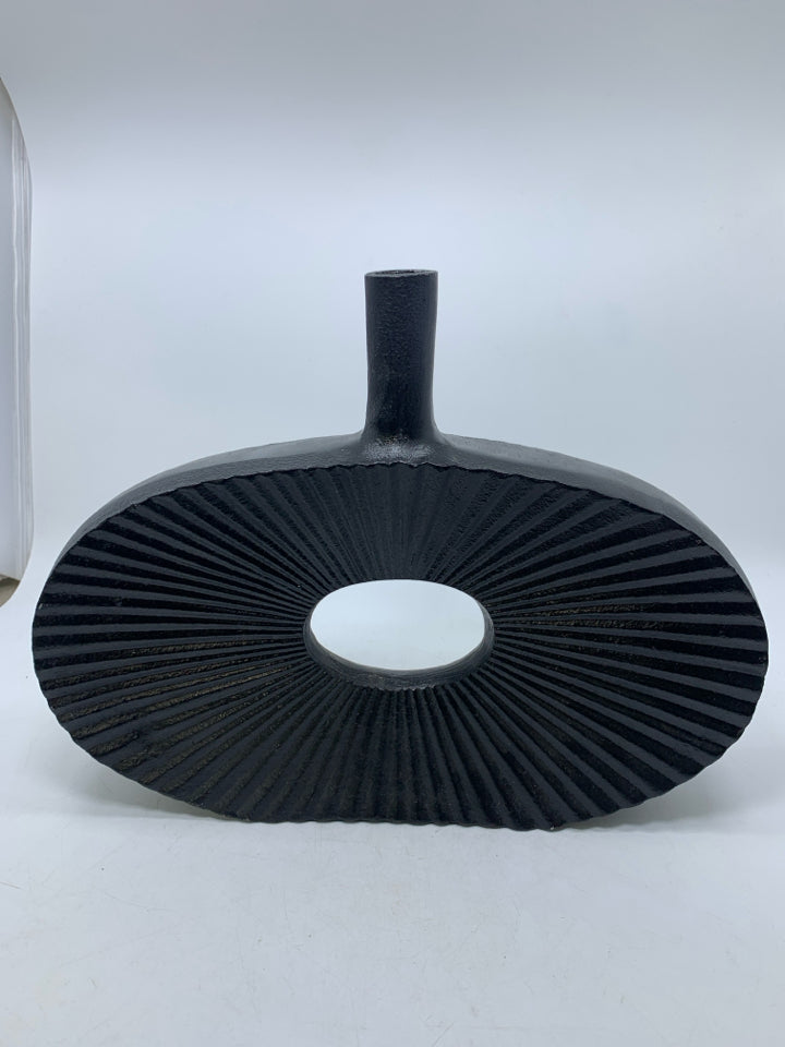 LARGE BLACK RIBBED METAL DONUT HOLE VASE.