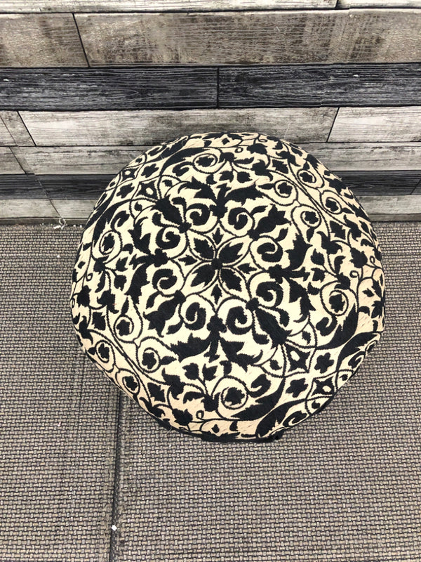 BLACK AND BROWN UPHOLSTERED STOOL/ POUF.