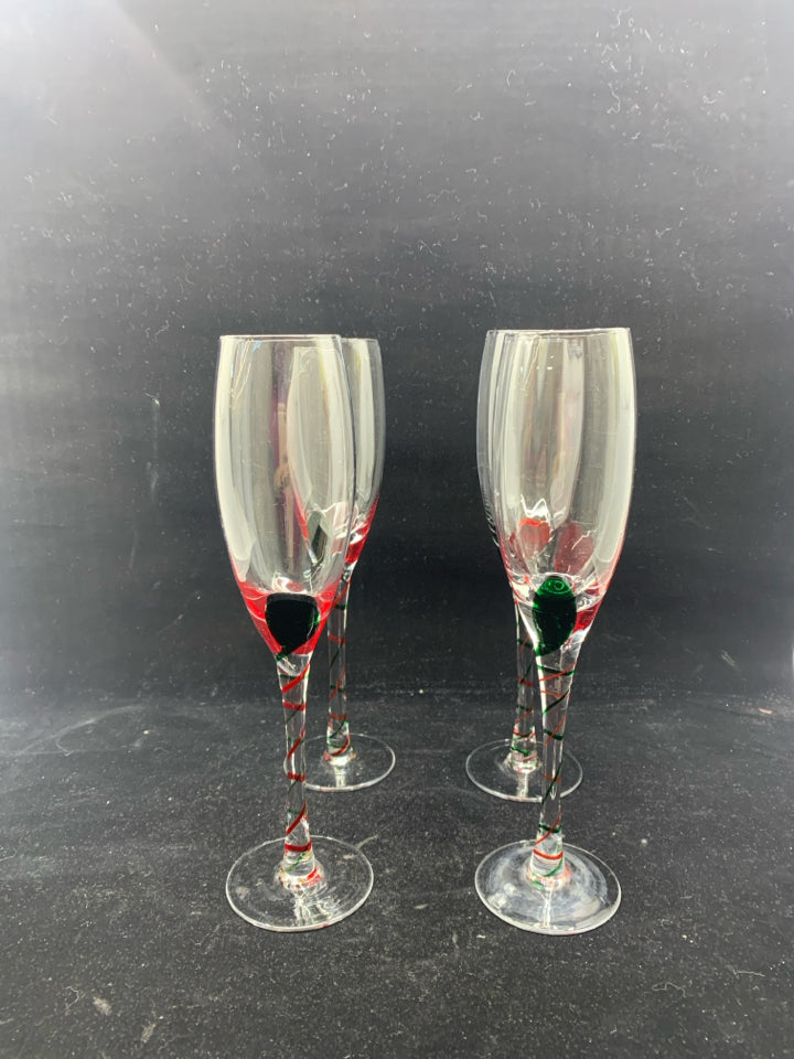 4 GLASS CHAMPAGNE FLUTES W/ RED+GREEN SWIRL DESIGN.