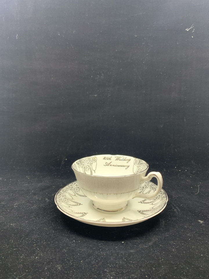 VTG WHITE SILVER TEACUP AND SAUCER.