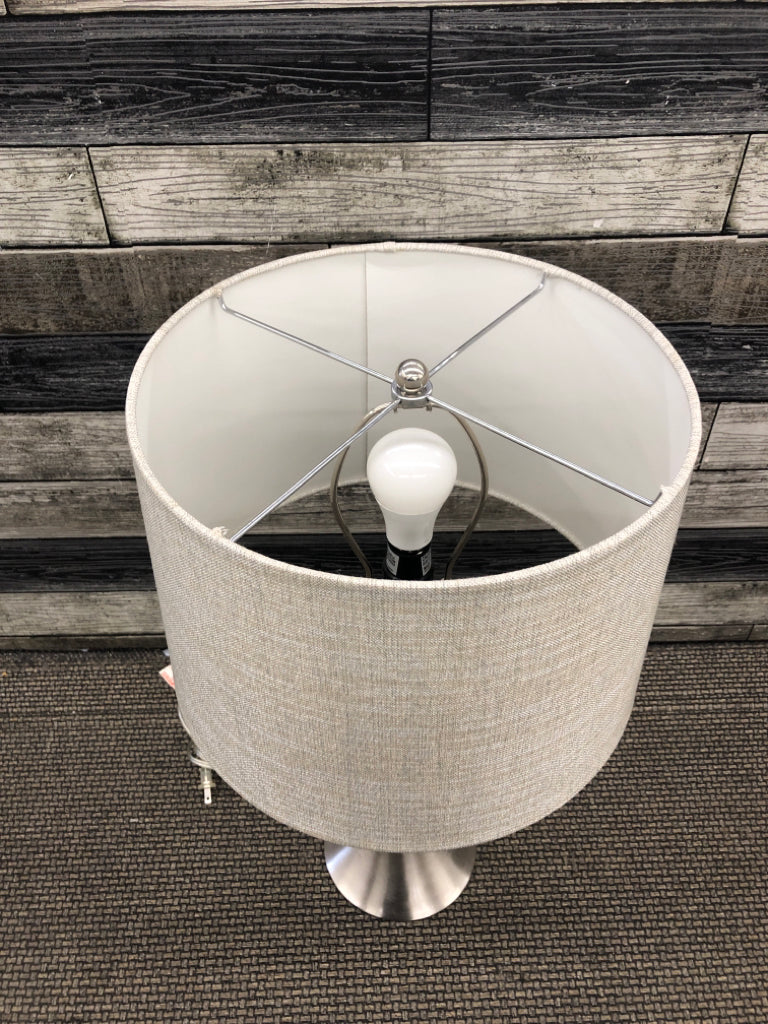 STAINLESS STEEL BASE LAMP W/ TEXTURED SHADE.