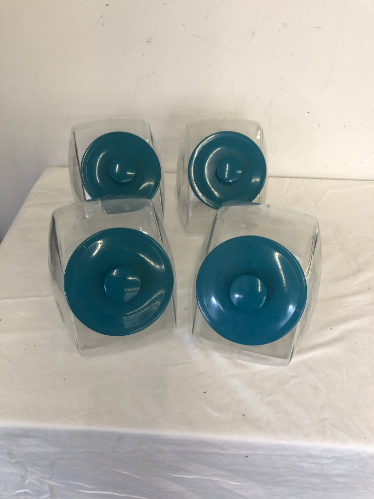 4 TEAL LID GLASS CANDY JAR STYLE CANISTERS.