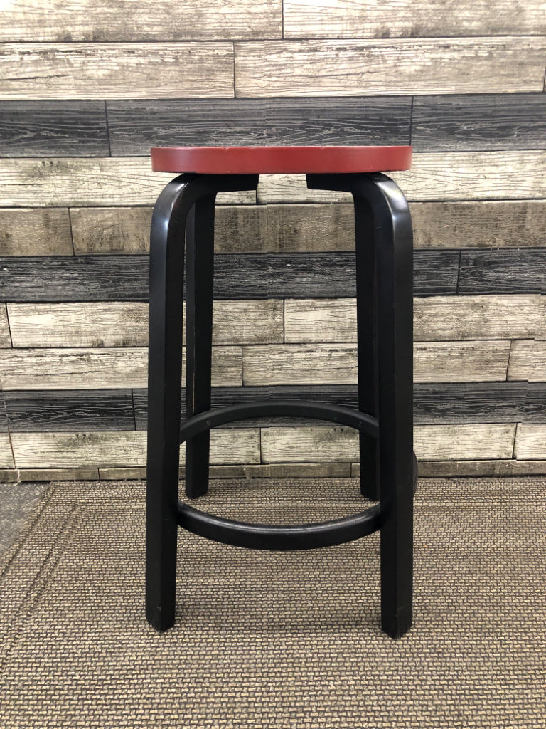 BLACK WOOD BASE W RED SEAT STOOL.