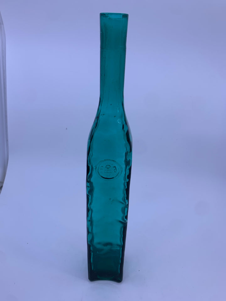 EMPTY TEAL GLASS DECORATIVE BOTTLE.