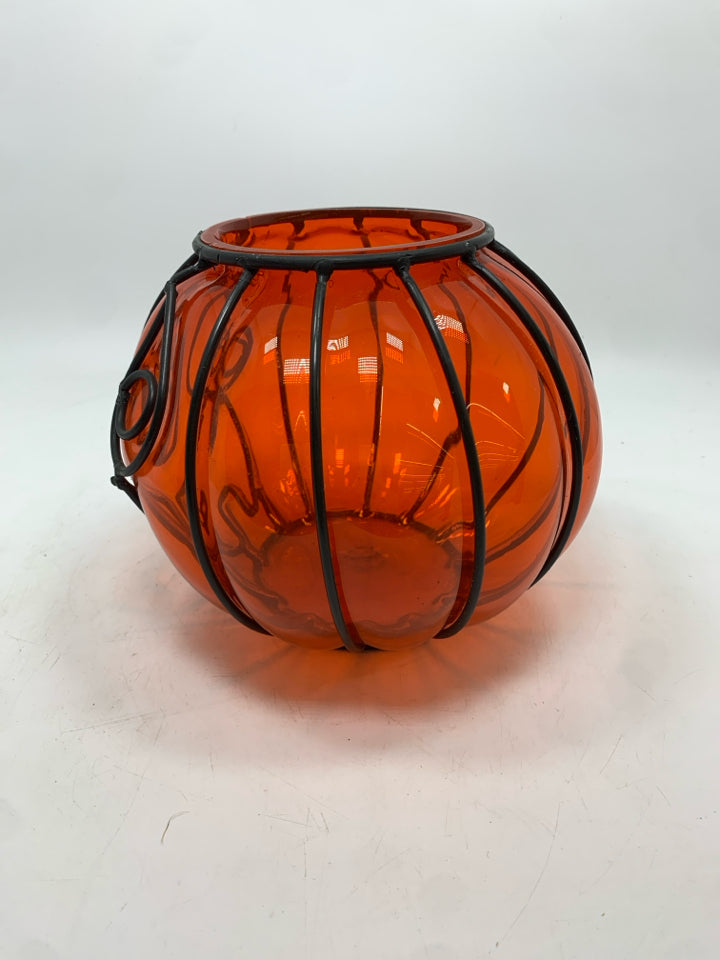 ORANGE GLASS IN BLACK PUMPKIN FACE CANDLE HOLDER.