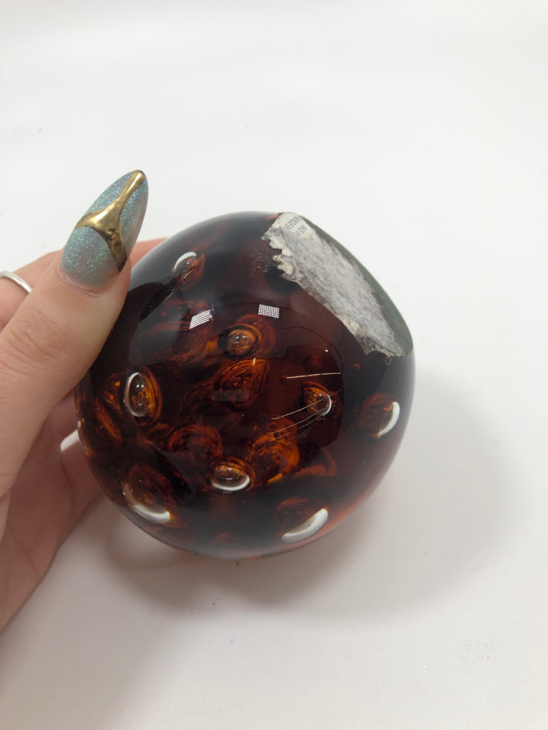 SM AMBER GLASS BUBBLE PAPER WEIGHT.