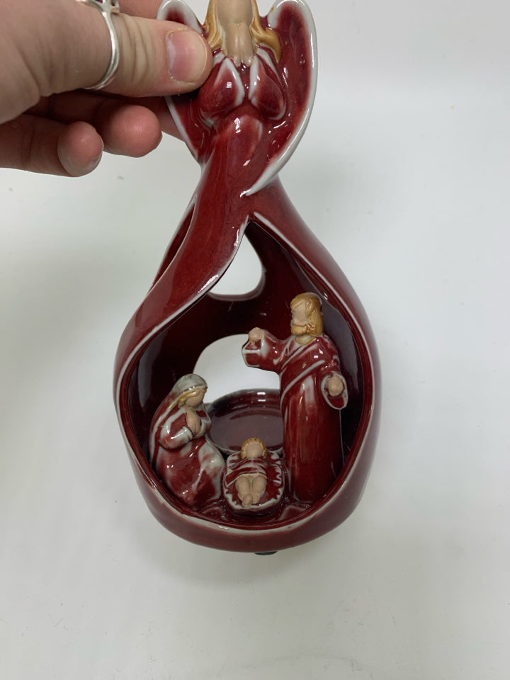 POTTERY DARK RED ANGEL W/ MARY/JOSEPH INSIDE TEA LIGHT HOLDER.