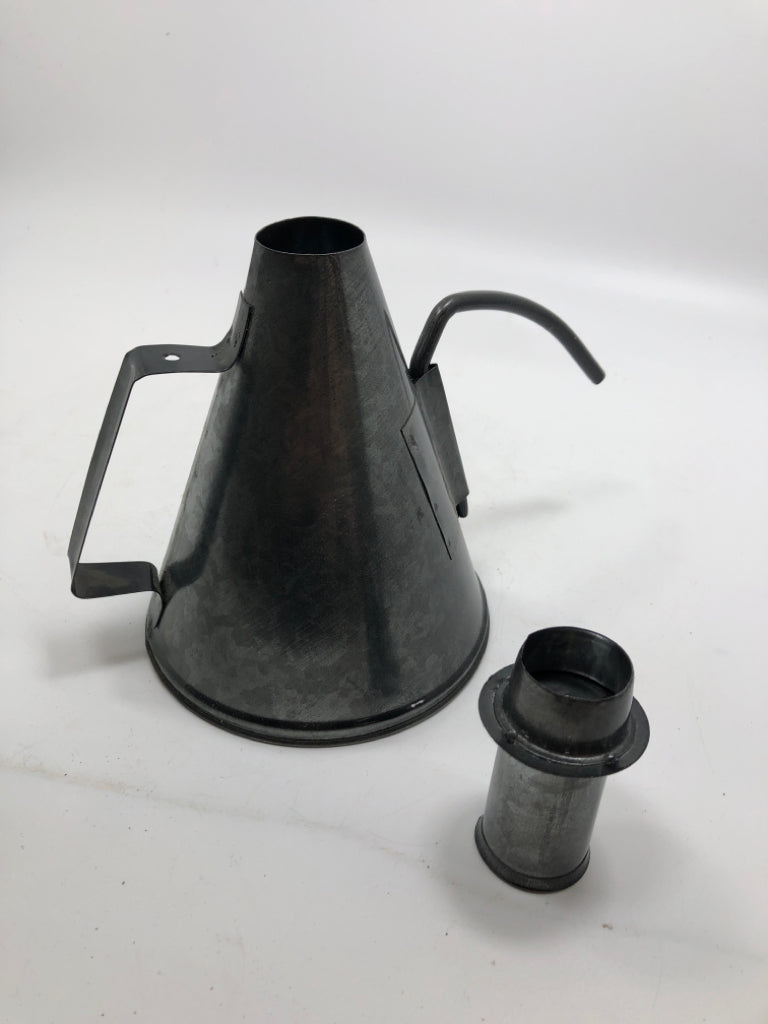 METAL OIL CAN CANDLE STICK HOLDER.