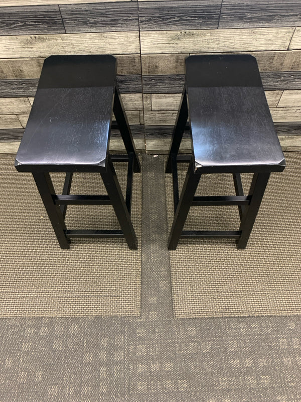 2 BLACK SADDLE SEAT STOOLS.