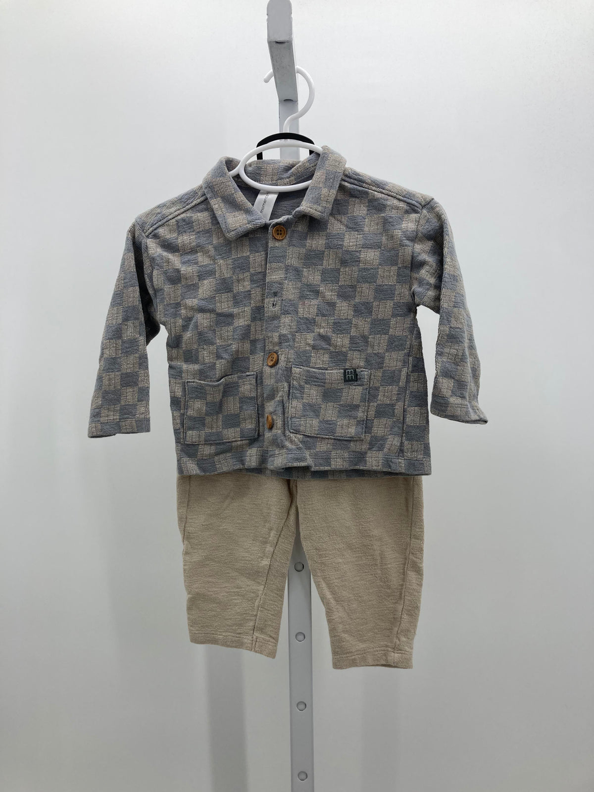 CHECKERED SHIRT AND TAN PANTS