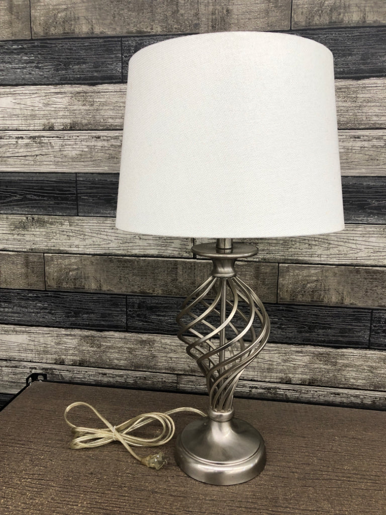 SILVER SWIRL LAMP W/CREAM SHADE.