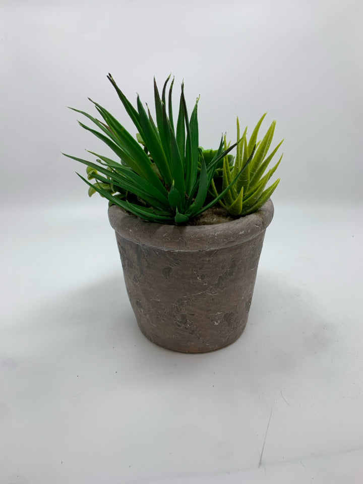 FAUX SUCCULENTS IN PLASTER POT.