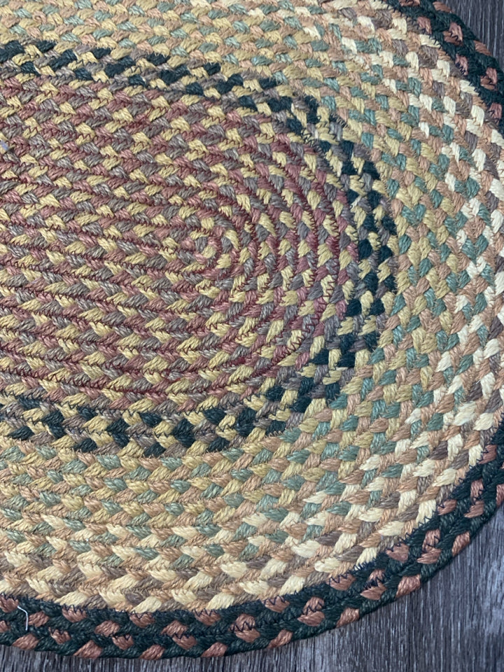 OVAL BRAIDED RUG.