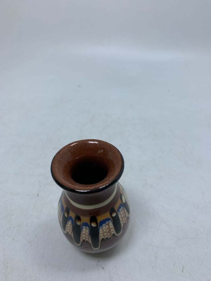 DARK BROWN TERRA COTTA BUD VASE W/ COLORFUL PATTERN.