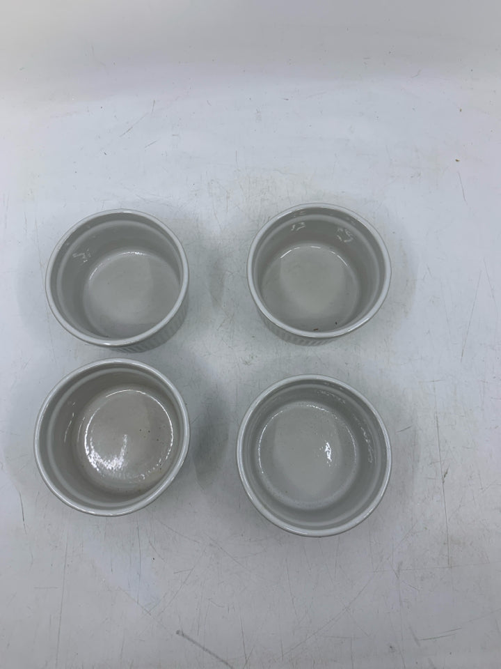 4 WHITE SINGLE BAKERS W/ EMBOSSED CIRCLES.