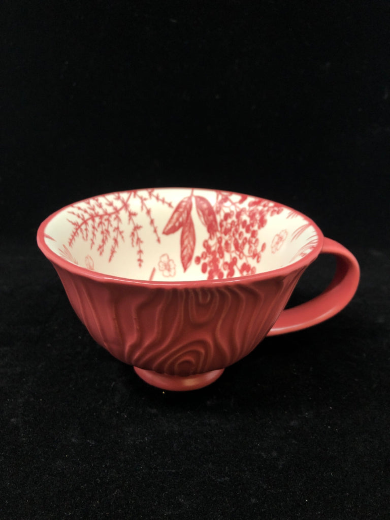 RED MUG W/FLORAL DETAILS INSIDE.