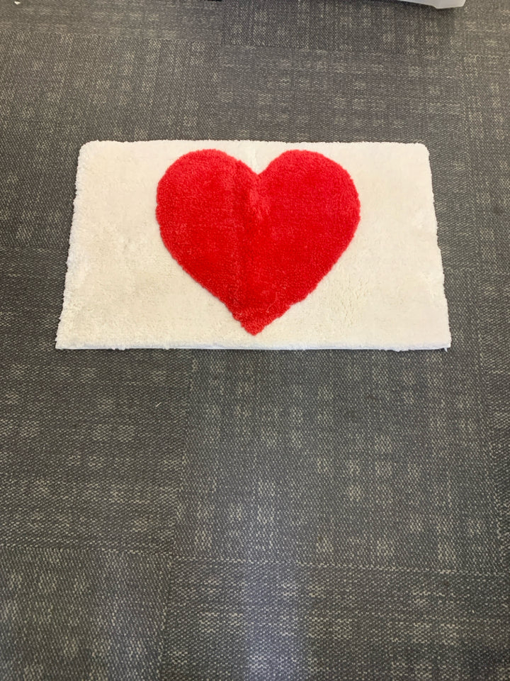 WHITE W RED HEART BATH MAT.